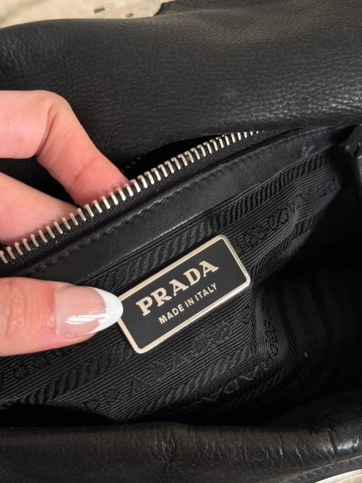 Black leather Prada bag