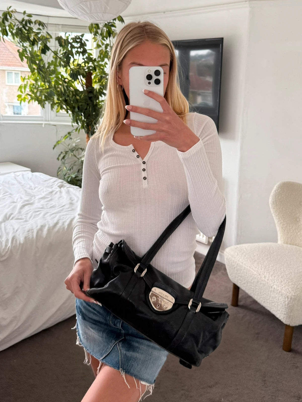 Black leather Prada bag