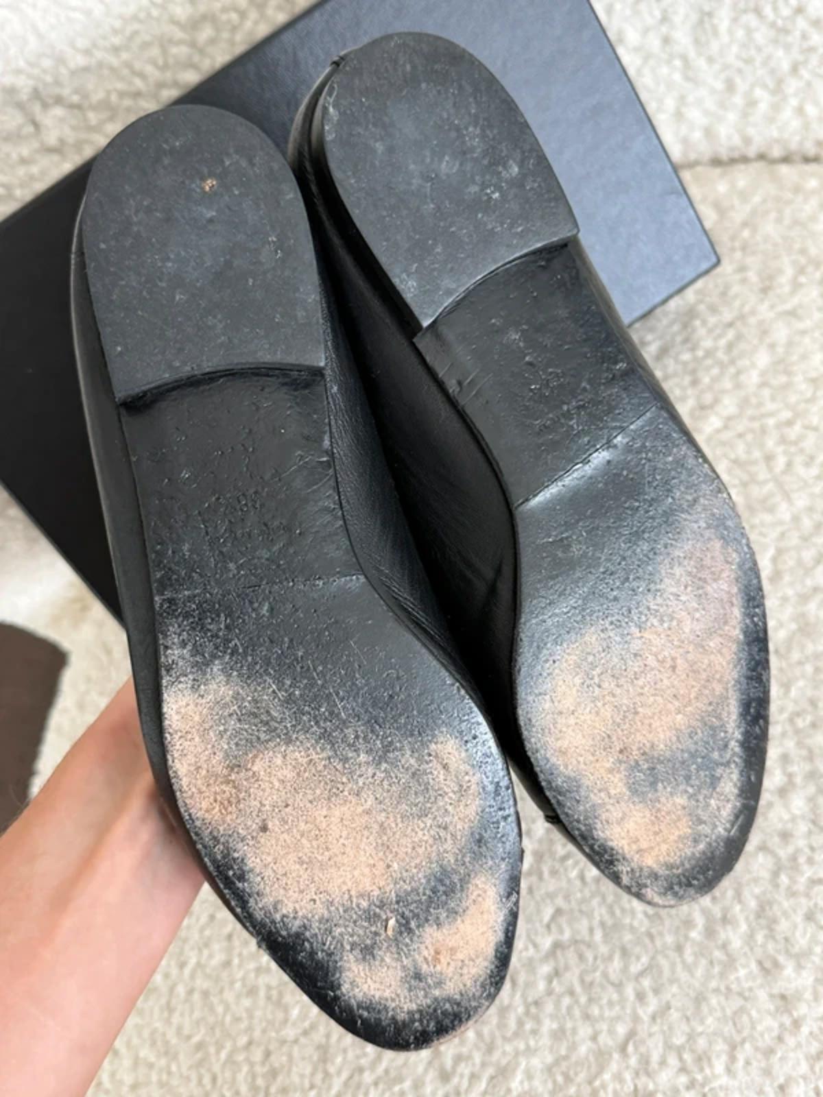 Chanel black leather ballet flats