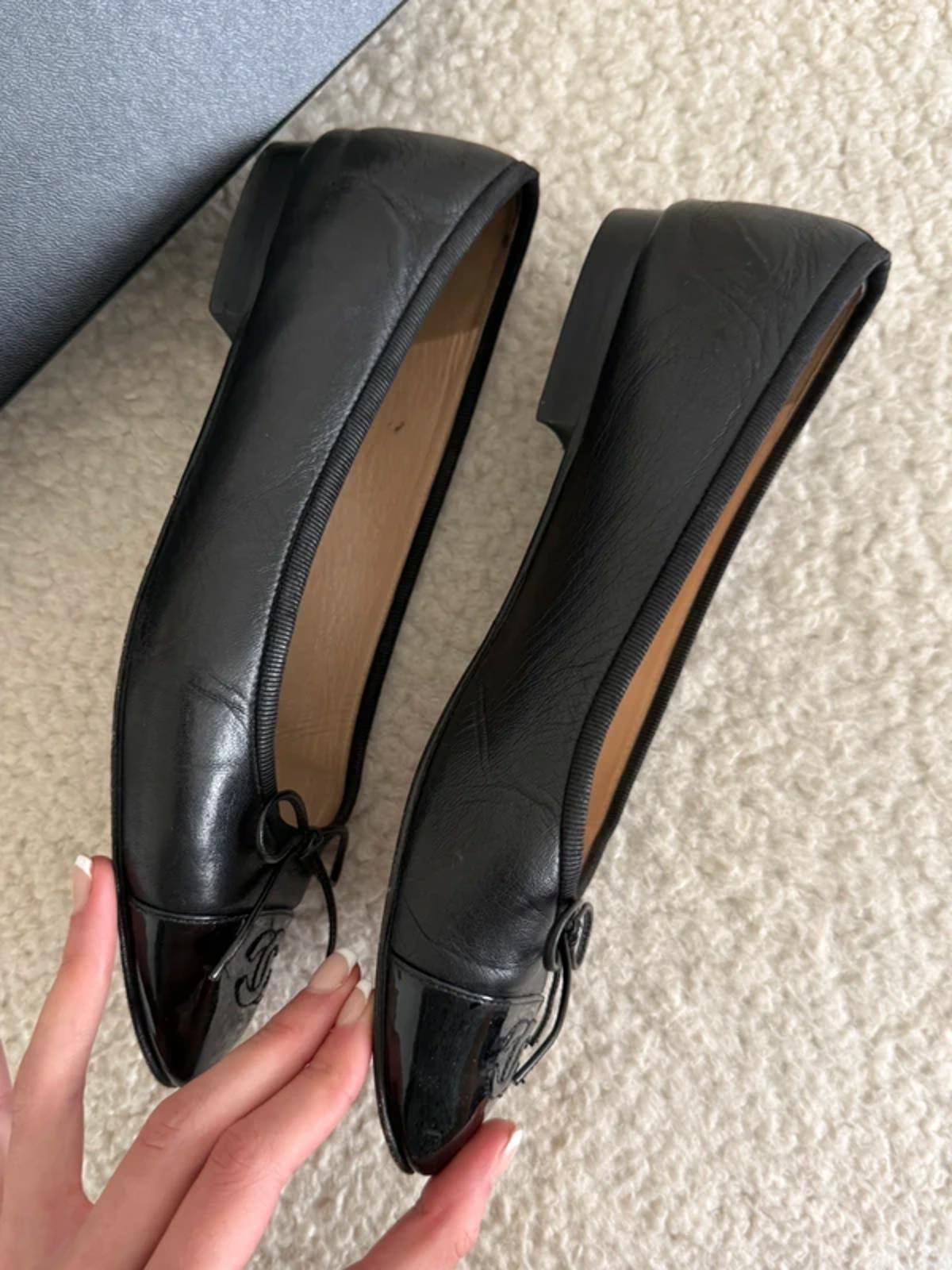 Chanel black leather ballet flats