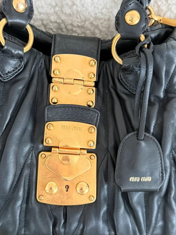 miu miu black matelassé leather coffer bag